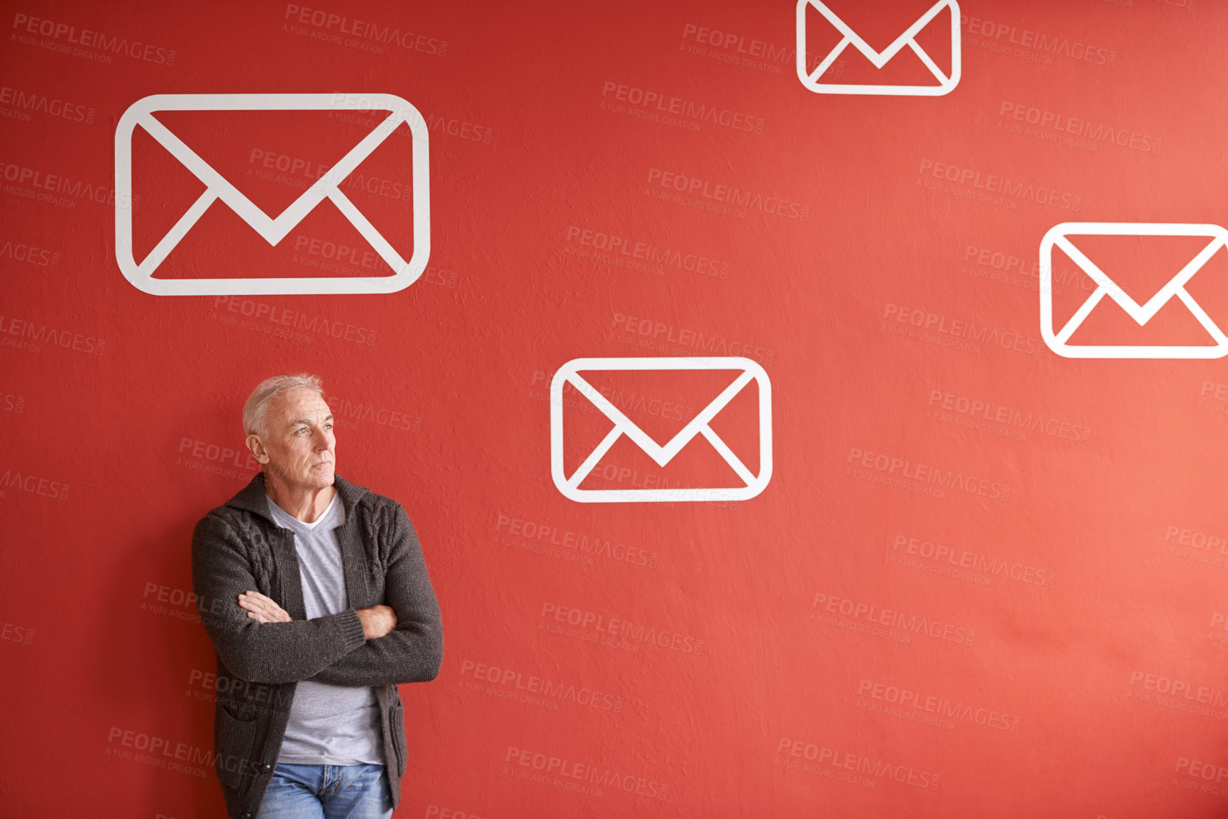 Buy stock photo Email symbol, thinking and senior man with arms crossed, ideas and employee on a red studio background. Mature person, model and guy with planning and icon for communication, decision and envelope