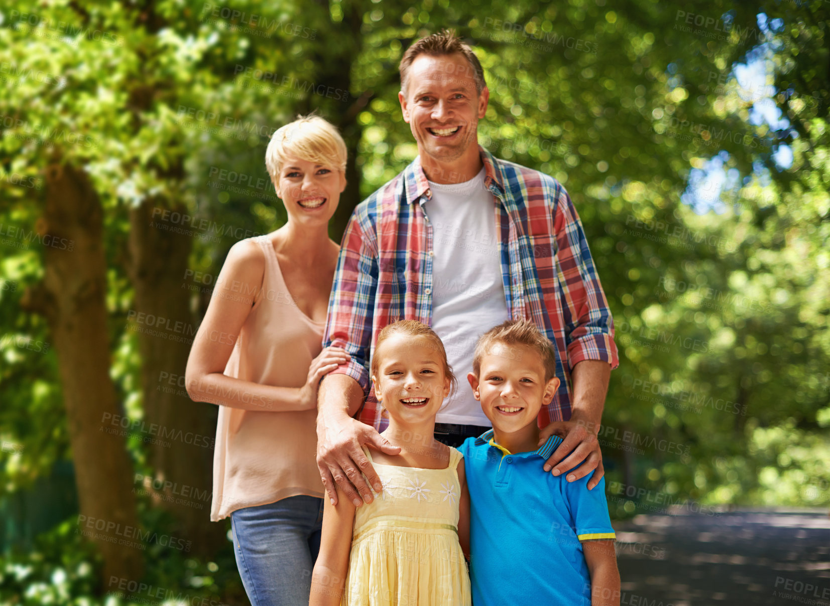 Buy stock photo Happy, portrait and family in park on holiday with care and support from parents for children. Mother, father and kids smile in forest in summer or adventure on vacation and relax together in woods