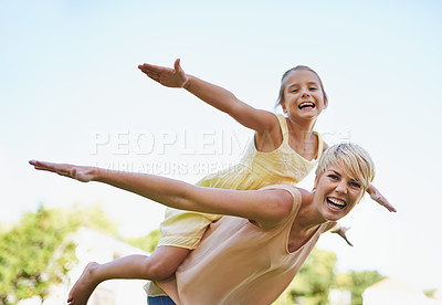 Buy stock photo A portrait of a happy mother and daughter playing in the park on a sunny day