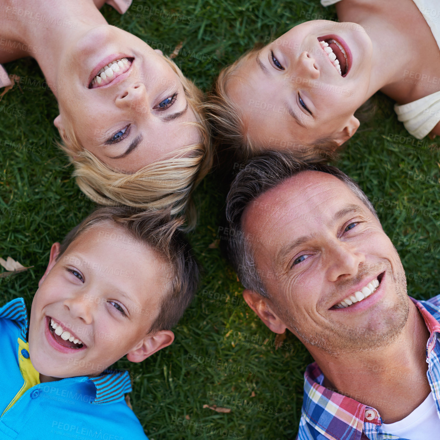Buy stock photo Parents, children and portrait on grass from above or family holiday or travel destination, environment or happiness. Men, woman and siblings in backyard for summer bonding in Australia, kids or love