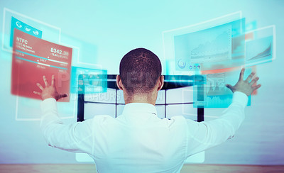 Buy stock photo A rear view shot of a man using a futuristic computer. All screen content is designed by us and not copyrighted by others, and upon purchase a user license is granted to the purchaser. A property release can be obtained if needed.