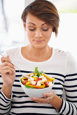 Buy stock photo Young woman, diet and salad or healthy food for detox, breakfast and lunch at home. A happy person with green fruits, vegetables and eating lettuce or vegan meal in bowl for nutrition and wellness