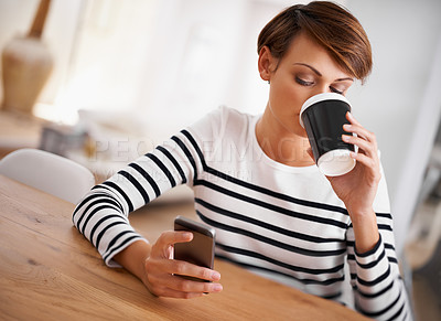 Buy stock photo Phone, reading and woman with coffee in dining room networking on social media, mobile app or internet. Research, technology and female person with cappuccino scroll on cellphone at modern apartment.