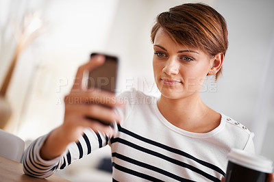Buy stock photo Phone, smile and woman with coffee in living room networking on social media, mobile app or internet. Happy, technology and female person with cappuccino scroll on cellphone in lounge at apartment.