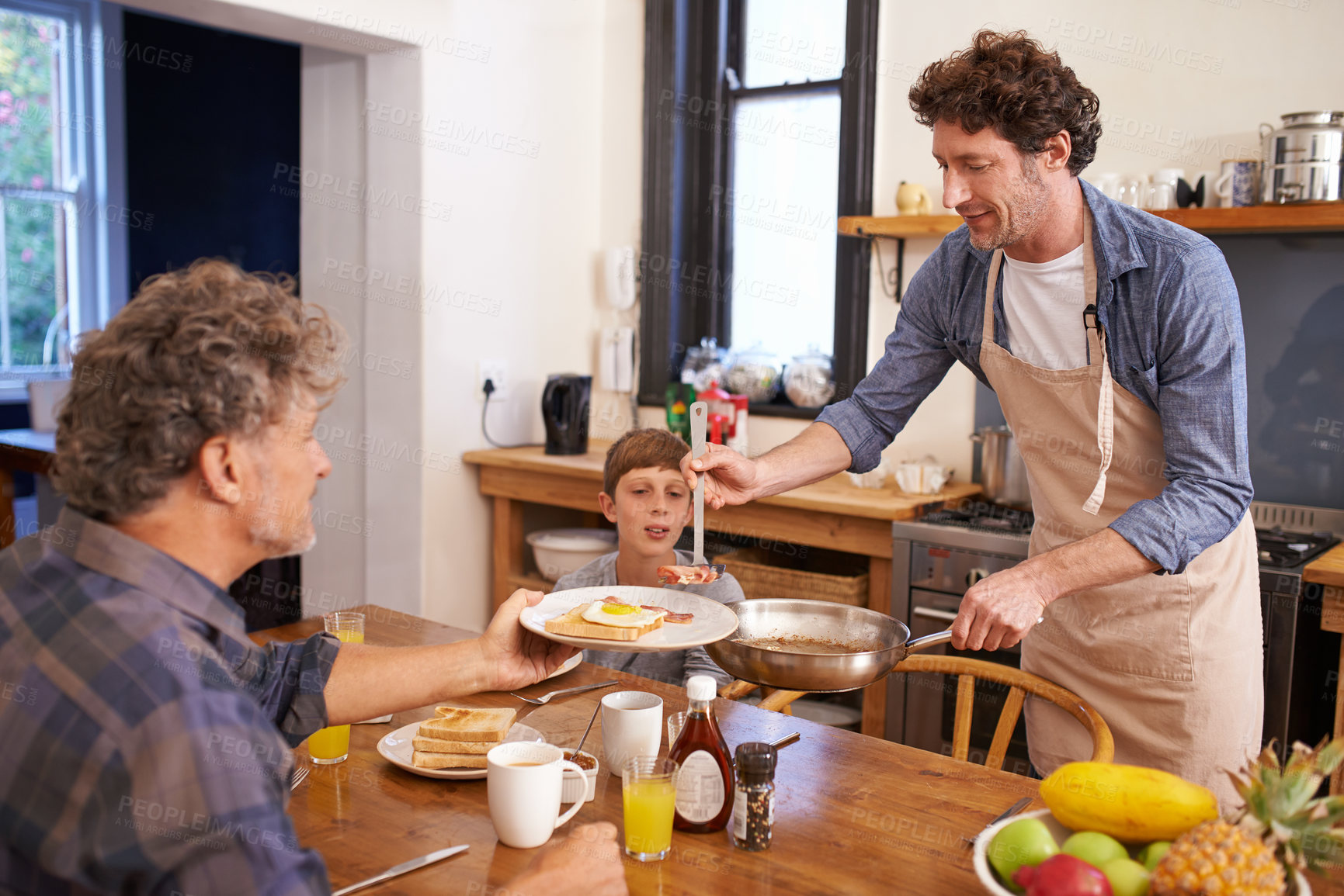 Buy stock photo Gay, couple and child in kitchen for breakfast with happiness in morning to eat for bonding, support and care. Adoption, family and mature men for meal with coffee, table and enjoy together with love