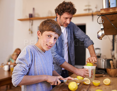 Buy stock photo Father, child and lemon juice or fruit in kitchen or lemonade preparation or healthy beverage, vitamin c or gut health. Son, portrait and male person with tool or family, drinking or ingredient