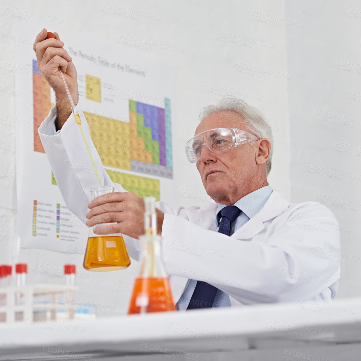 Buy stock photo Low angle shot of a mature scientist working in a lab