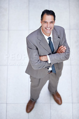 Buy stock photo Happy, portrait and high angle of man in business or office with professional confidence and pride. Above, entrepreneur and person smile in lobby excited for morning in London at corporate workplace