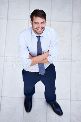 Buy stock photo Business, portrait and high angle of man with arms crossed in office with confidence and pride. Above, entrepreneur and person in lobby to start morning in corporate London workplace with perspective