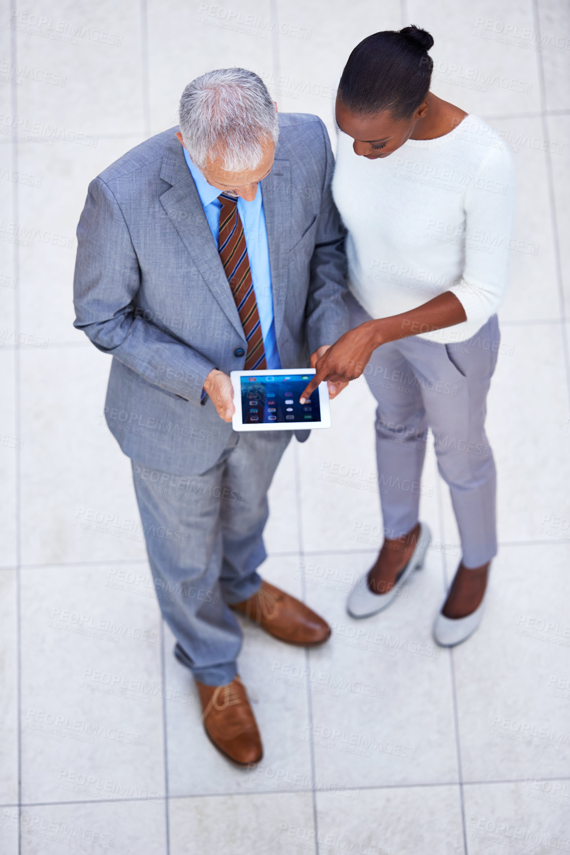 Buy stock photo Businessman, black woman and employees with tablet in office for internet, email and planning for business meeting. Manager, assistant and team with diversity from above view with digital pad