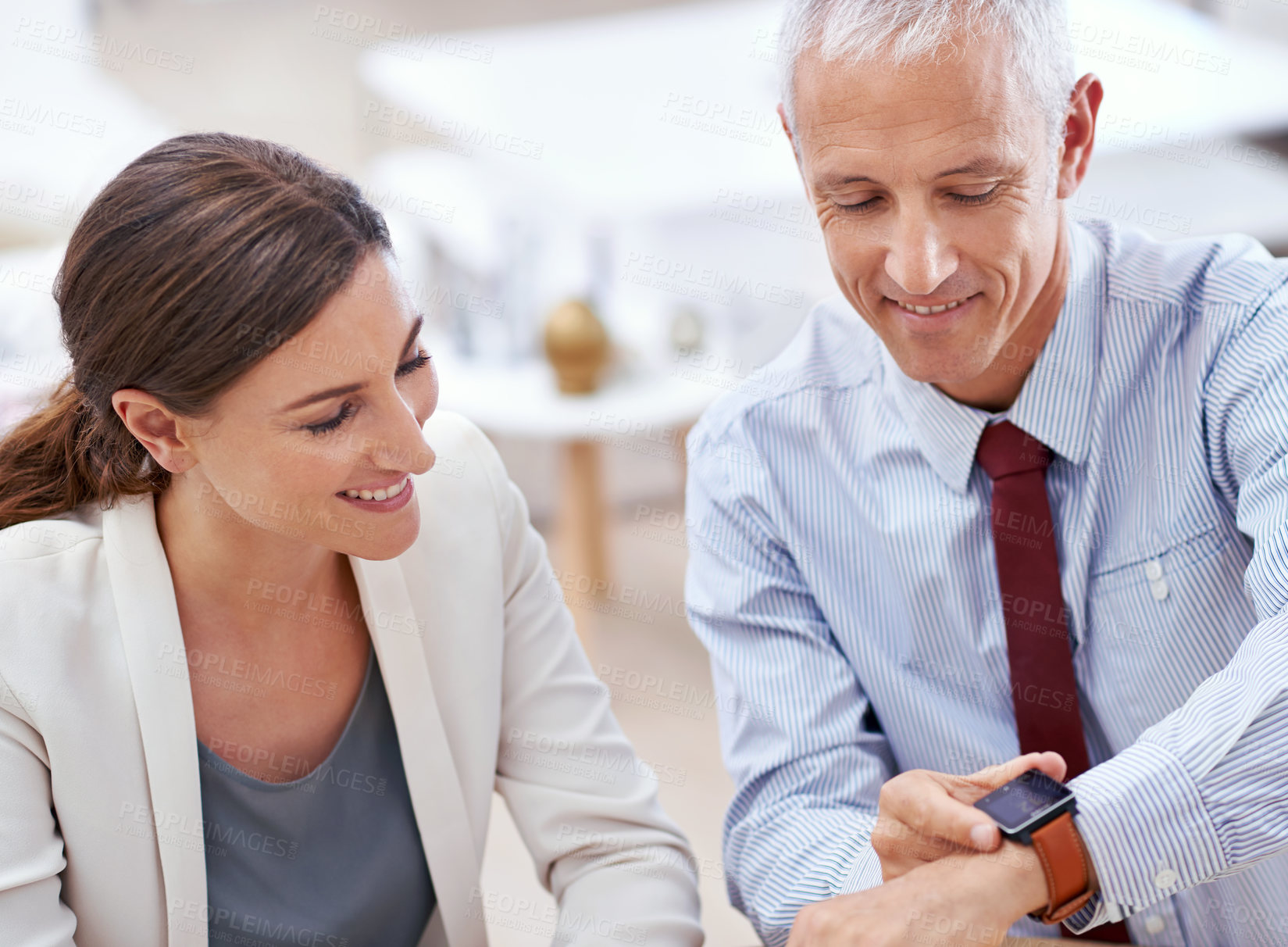 Buy stock photo Business people, colleagues and wrist watch in office with future technology, screen or online. Mature, male person and woman with smile at finance agency or time management, teamwork or corporate