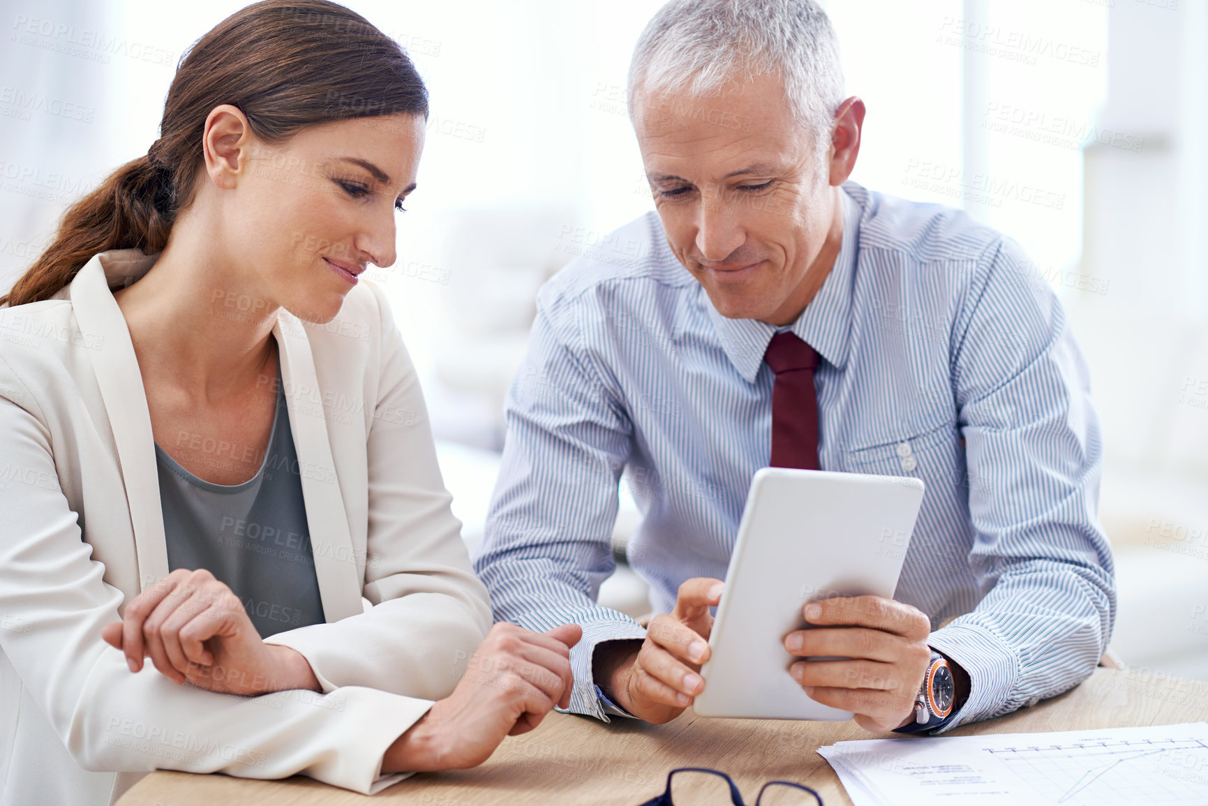 Buy stock photo Discussion, mature man and businesswoman with tablet for internet and online work for training on sales target or skills. Employee, manager or mentor with information technology for development.