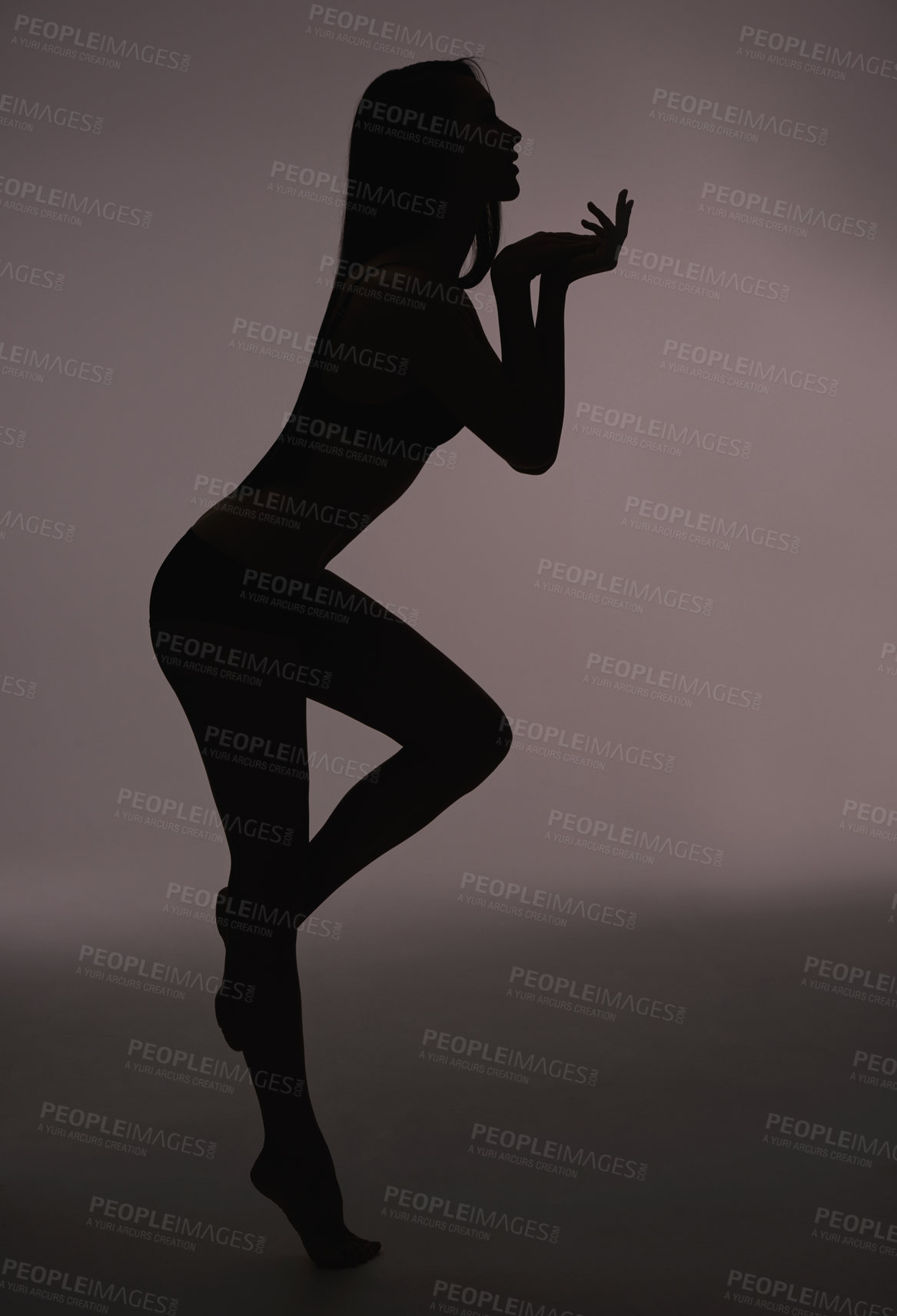 Buy stock photo Dancer, woman and silhouette with beauty, body care and sensual on a dark studio background. Person, profile and model with shadow figure and seductive with wellness and natural pose with slim girl