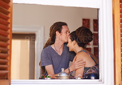 Buy stock photo Shot of an affectionate young Rastafarian couple at home