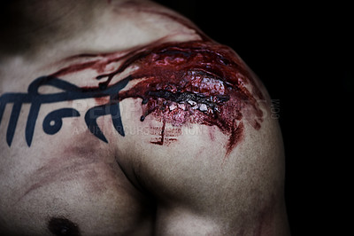 Buy stock photo A cropped shot of a man with a serious wound on his shoulder