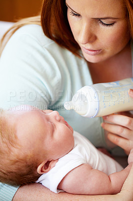 Buy stock photo Mom, milk and feed baby from bottle for nutrition, healthy breakfast and diet in the morning. Mother, child and feeding newborn formula food for growth, development and wellness together in home.