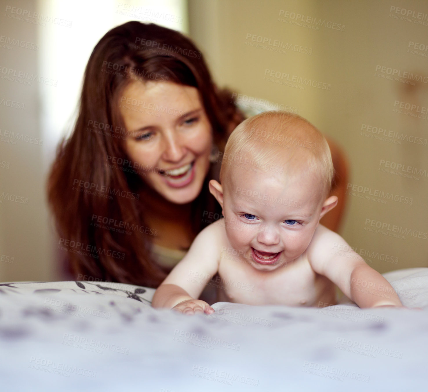 Buy stock photo Laughing, playing and a mother with a baby on the bed for bonding, love and care in the morning. Wake up, smile and a mom with a kid or family together in the bedroom of a house for happiness
