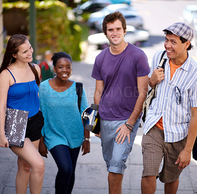 Buy stock photo Shot of a college students hanging out on campus