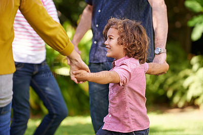 Buy stock photo Happy family, holding hands and kid dance outdoor or play game in summer together in a circle at park. Ring a rosy, smile and child in garden on holiday, vacation and bonding with parents in nature
