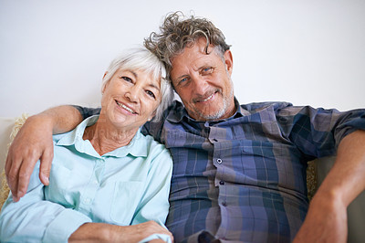 Buy stock photo Old couple, hug and relax in portrait with happiness at home, love and security with comfort for bonding. Marriage, partner and retirement together with smile, trust and loyalty with people in lounge