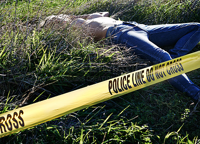 Buy stock photo Shot of a woman's body cordoned off with police tape