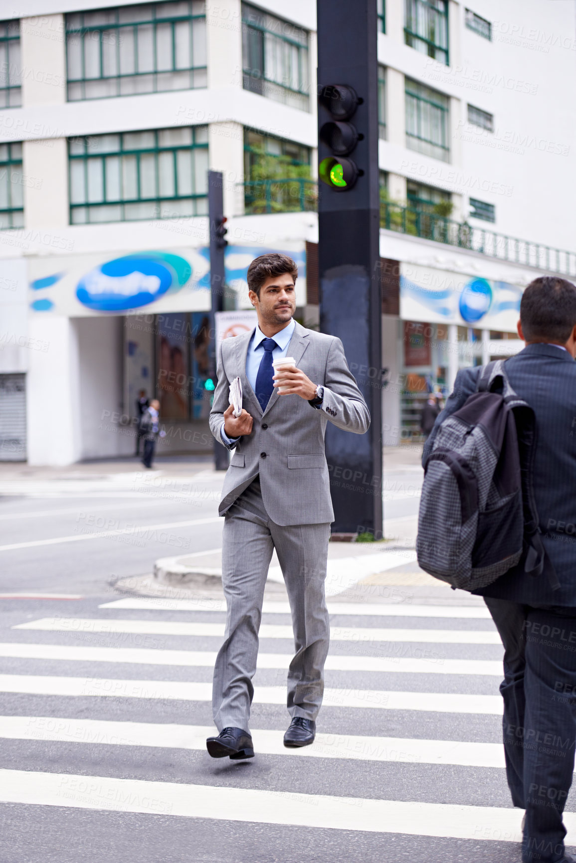 Buy stock photo Businessman, coffee and newspaper in city for business, walking and commute to work. Professional, male person and expresso for caffeine, energy and article for news, cappuccino and man in New York