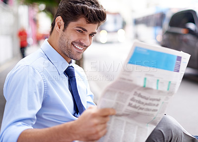 Buy stock photo Smile, businessman and reading newspaper for information, daily news and updates on local events. Professional, male person and outdoor with article for knowledge, stories and newsletter in city