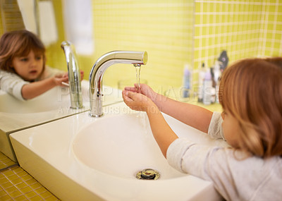 Buy stock photo Girl, bathroom and hands with washing, hygiene and cleaning with mirror at home. Child, faucet and reflection for healthy, development and childhood with morning routine at house for cleanliness
