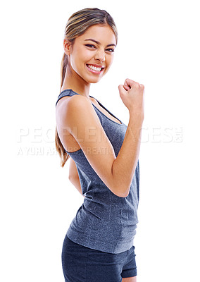 Buy stock photo Studio portrait of an attractive woman wearing sports clothing looking enthusiastically happy