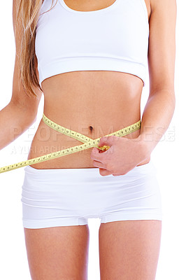 Buy stock photo Person, studio and waistline for measuring, health and wellness with diet and weight loss. Woman, abdomen and commitment for training, goals and fitness with exercise or workout for proud body care