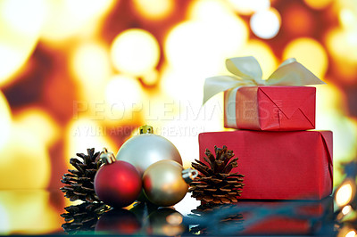 Buy stock photo Christmas decorations and presents against a background of lights