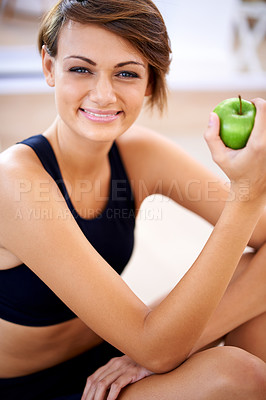 Buy stock photo Portrait, exercise and happy woman with apple in gym for diet, nutrition and wellness with healthy body. Face, fitness and smile of person eating fruit for vitamin c and benefits of organic food