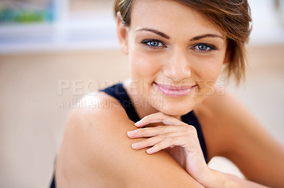 Buy stock photo Shot of a fit young woman sitting on a gym floor