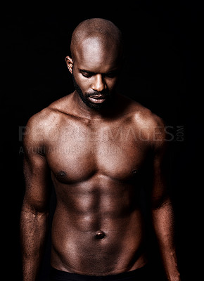 Buy stock photo Cropped shot of a calm muscular man isolated on black