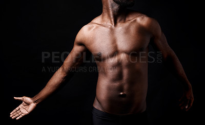 Buy stock photo Black man, fitness and muscle with shadow for exercise or workout on a dark studio background. Closeup of young African male person or bodybuilder with masculine or muscular figure on mockup space