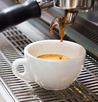 Buy stock photo Coffee machine, restaurant and espresso or hot drink in a cup at a small business on counter top. Kitchen, cafe and pouring latte or caffeine at shop with preparation with electrical appliance.