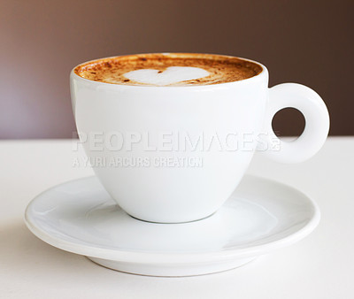 Buy stock photo Shot of a freshly-made cappuccino on a white table