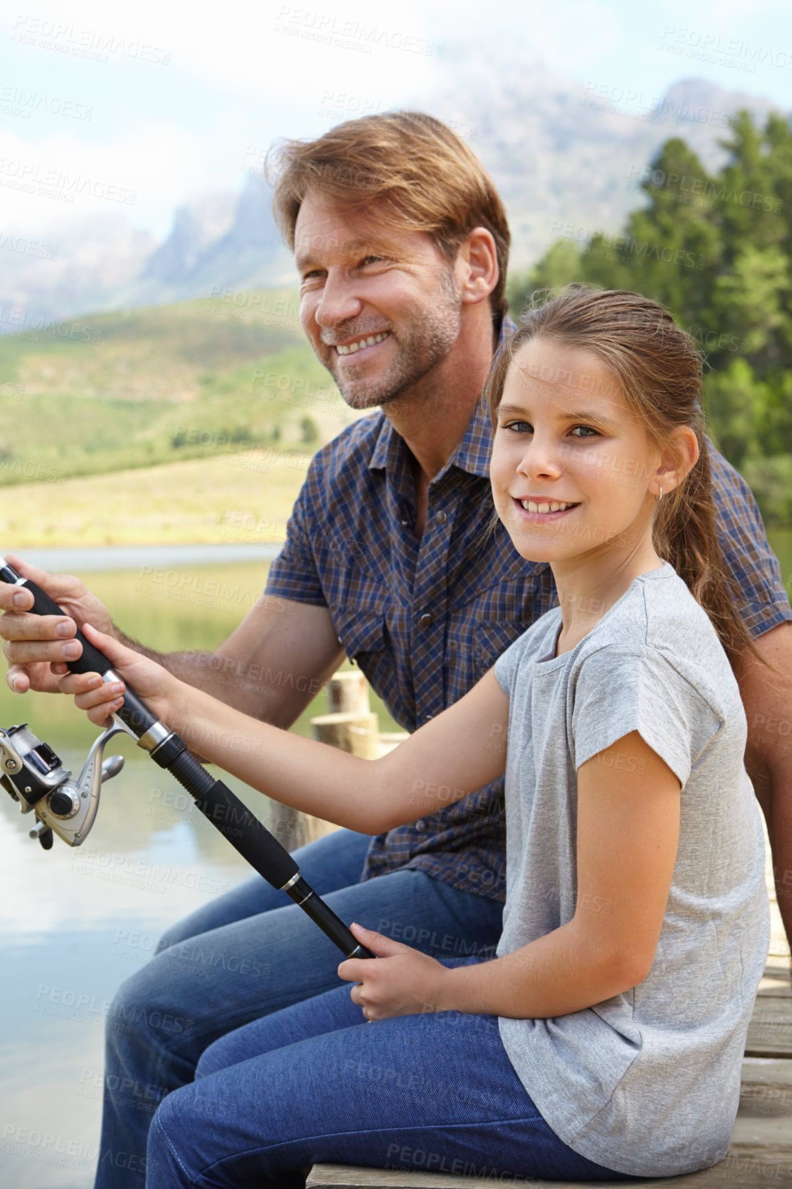Buy stock photo Shot of a father and daughter fishing