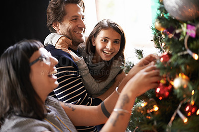 Buy stock photo Parents, child and excited at tree for Christmas decoration, bonding and fun in family home. Festive, xmas decor and mother with girl kid, father and happy holiday for portrait, love and celebration.