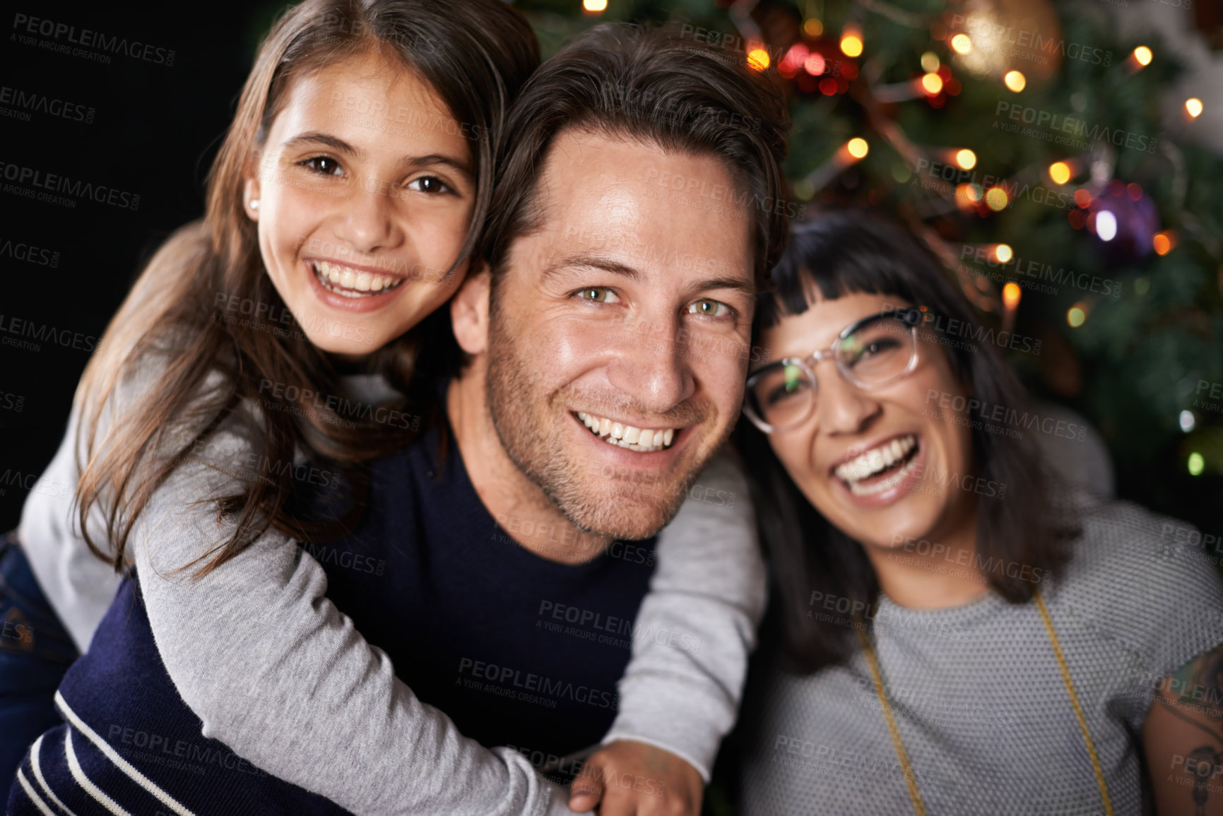 Buy stock photo Shot of a happy daughter with her parents on christmas