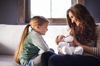 Buy stock photo Mother, baby and milk bottle with child in a family home with love, support and care together. Smile, relax and feeding for youth development and growth with mom and young girl on a living room sofa