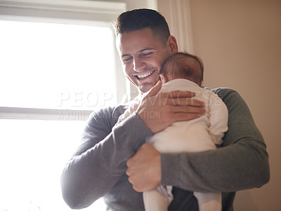 Buy stock photo Father, baby and bonding with happiness and hug, growth and child development with love at family home. Man, infant or newborn with smile and dad holding kid for comfort, childhood and parenting 