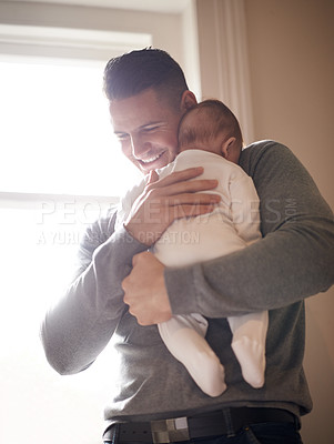 Buy stock photo Father, baby and hug in a family home with smile, support and love together with bonding. Trust, dad and young newborn with care and development in a new house with happy and proud man at a window 
