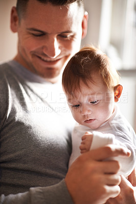 Buy stock photo Happy, love or father and baby in a house with care, trust and child development, support or bonding. Family, security and dad with kid at home for learning, safety or morning games with gratitude