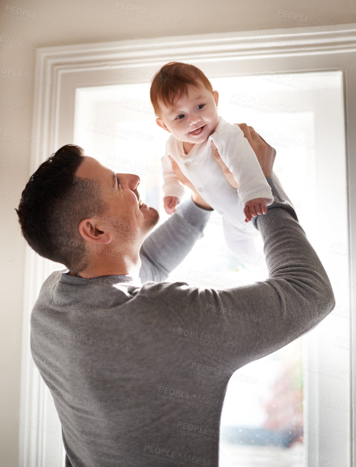 Buy stock photo Father, baby and fun in a new home with smile and relax of a newborn with dad together. Love, support and care in a family house with development, bonding and happy with trust and proud of kid