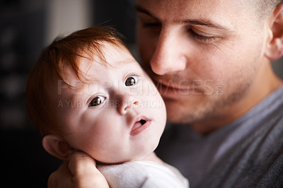 Buy stock photo Closeup of father, baby and pride with hug for bonding, love and child development with parenting. Peace, calm and connection in childhood, man and newborn kid for affection or moment at family home