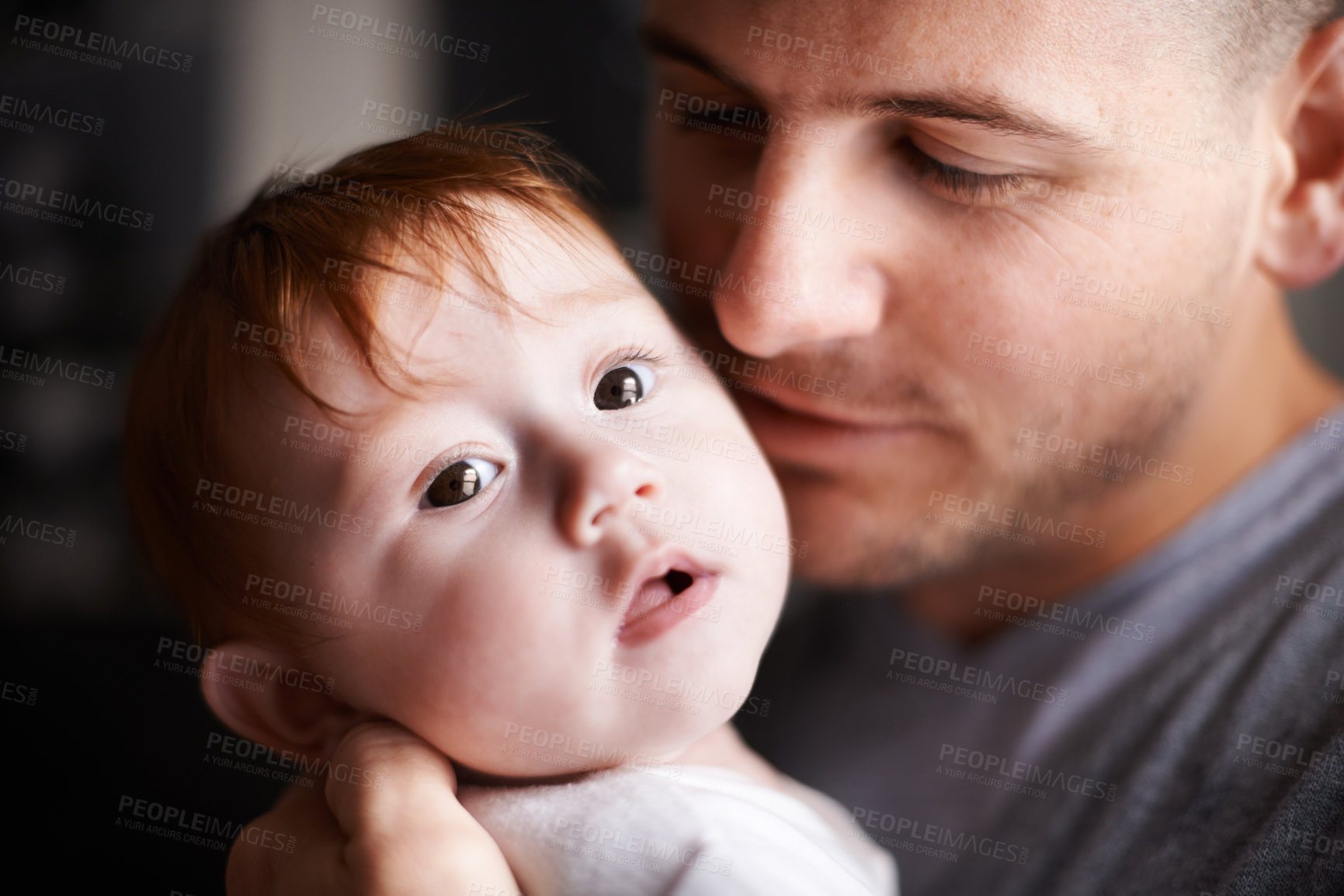 Buy stock photo Closeup of father, baby and pride with hug for bonding, love and child development with parenting. Peace, calm and connection in childhood, man and newborn kid for affection or moment at family home