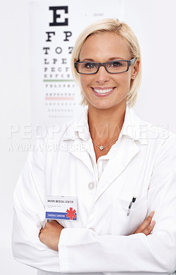 Buy stock photo Woman, glasses and portrait by chart for eye test, wellness and services with arms crossed and confidence. Person or ophthalmologist with optometry for vision and lens check or exam and assessment