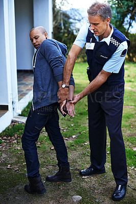 Buy stock photo Police officer, handcuffs and outdoor to arrest man for crime with safety, protection or security. People, law enforcement and government service for justice, peace or authority for danger in society