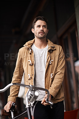 Buy stock photo City, travel and man with bicycle walking on sidewalk, thinking and eco friendly transport. Carbon neutral, sustainability and tourist on street for urban journey, morning commute and male with bike